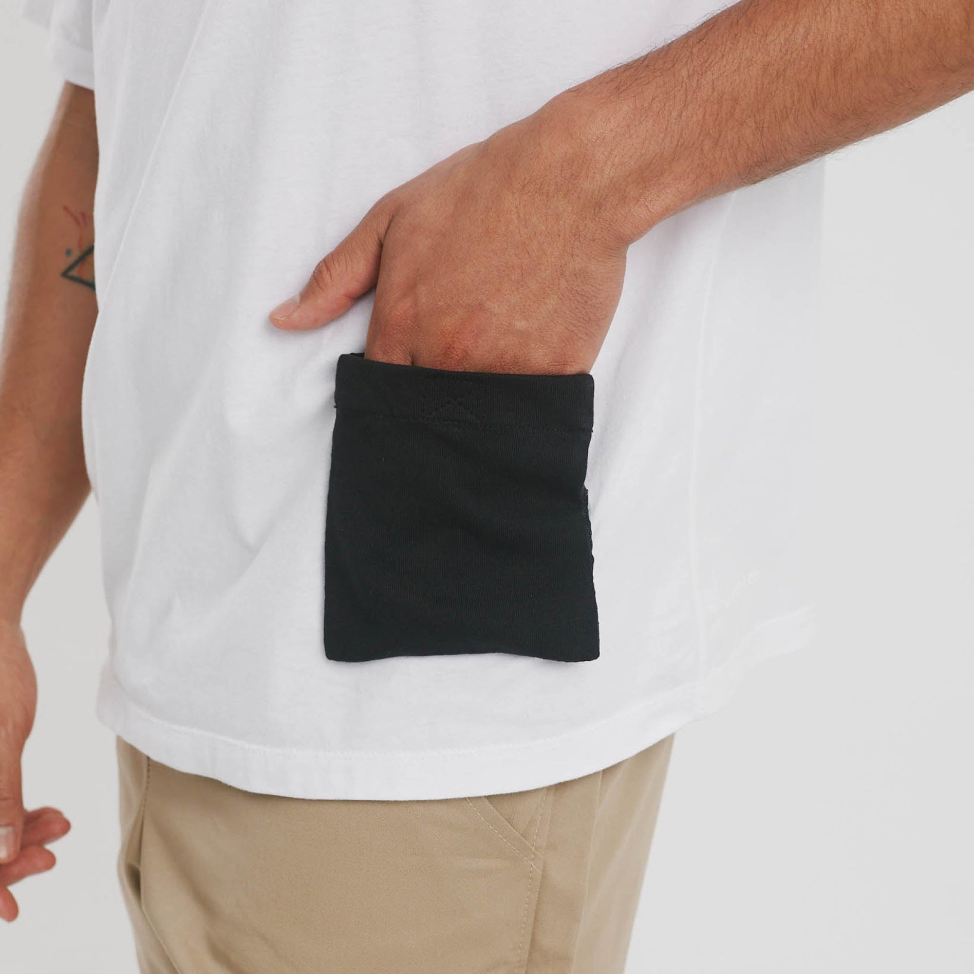 White iron-on pocket accessory on cotton tee_adaptive clothing add-on_The Shapes United