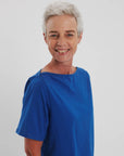 Side view of French blue boat neck tee_ relaxed fit soft cotton jersey